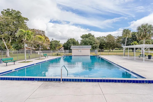 a view of a lake with a house in the background