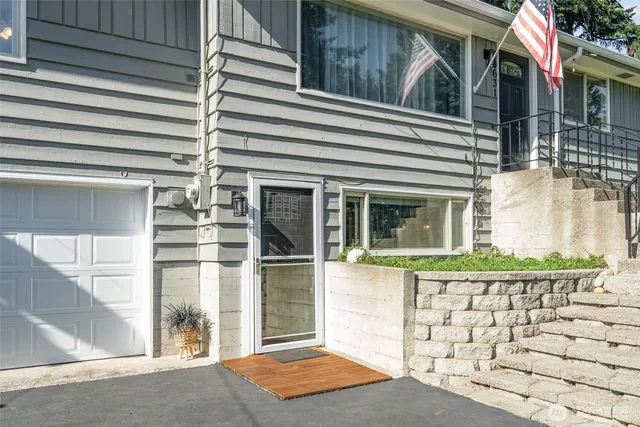 a view of a house with a door and wooden floor
