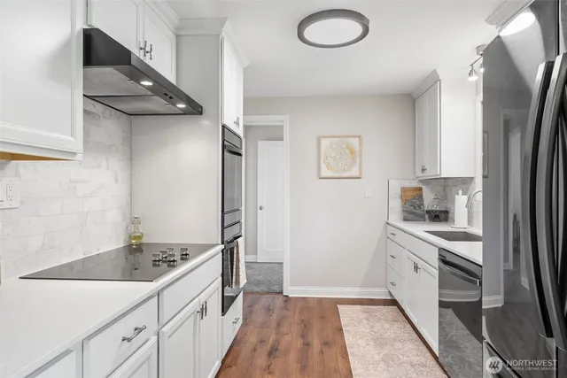 a kitchen with a sink stove and refrigerator