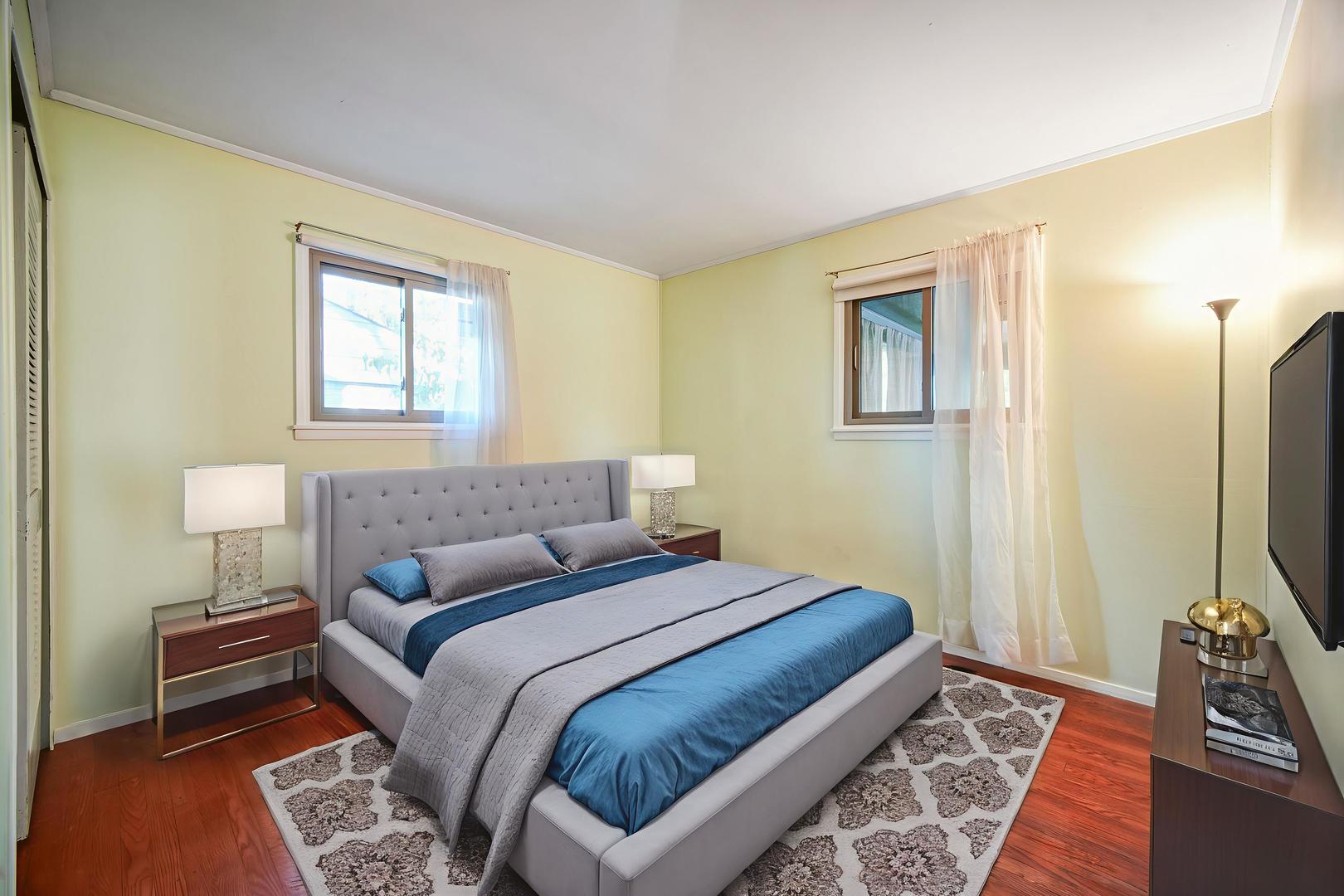 94 Wren Road Carpentersville, IL 60110 - Photo 12 of 21 a bedroom with a bed and a flat screen tv