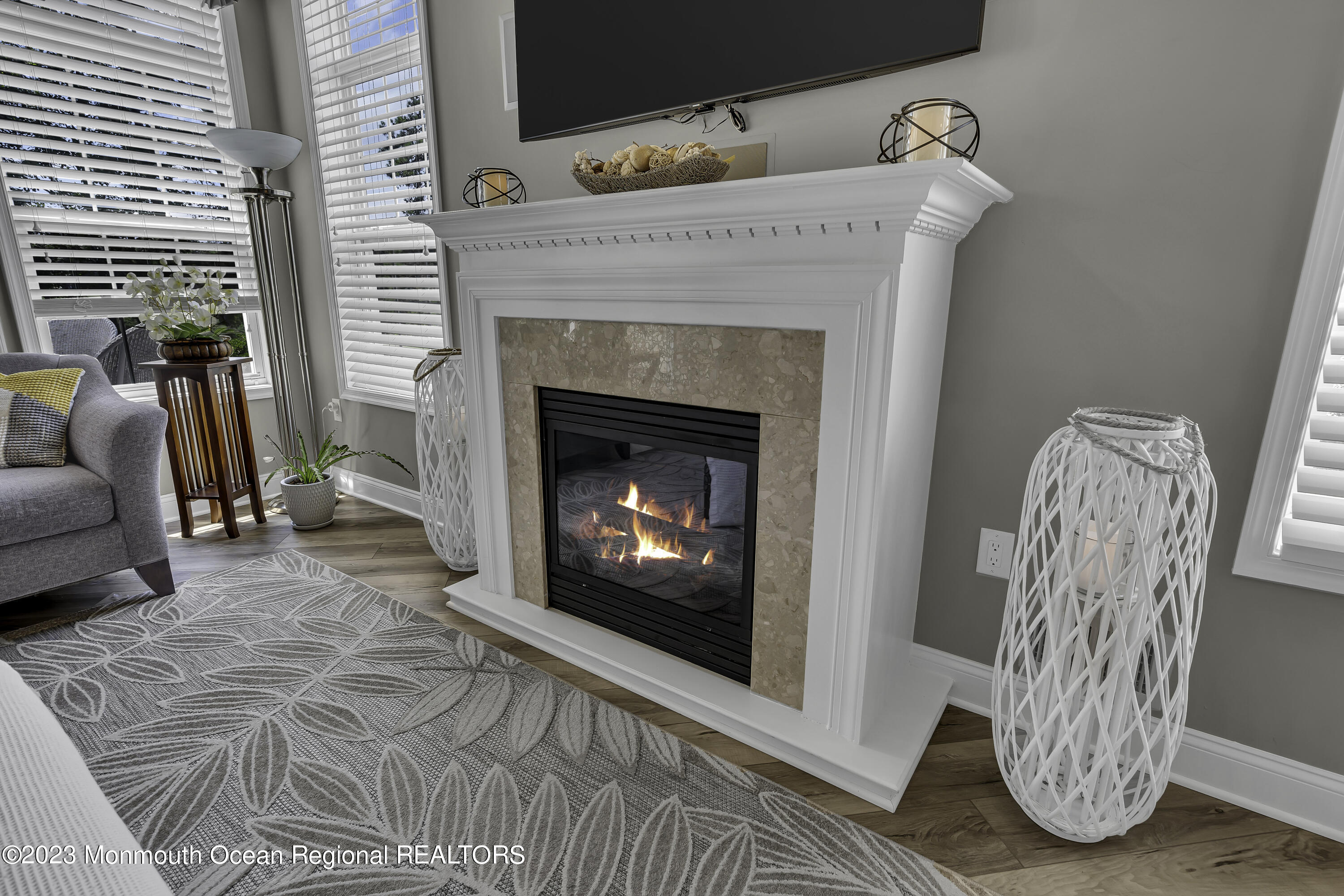63 Harvey Cedar Way Waretown, NJ 08758 - Photo 19 of 39 a view of a livingroom with furniture and a fireplace