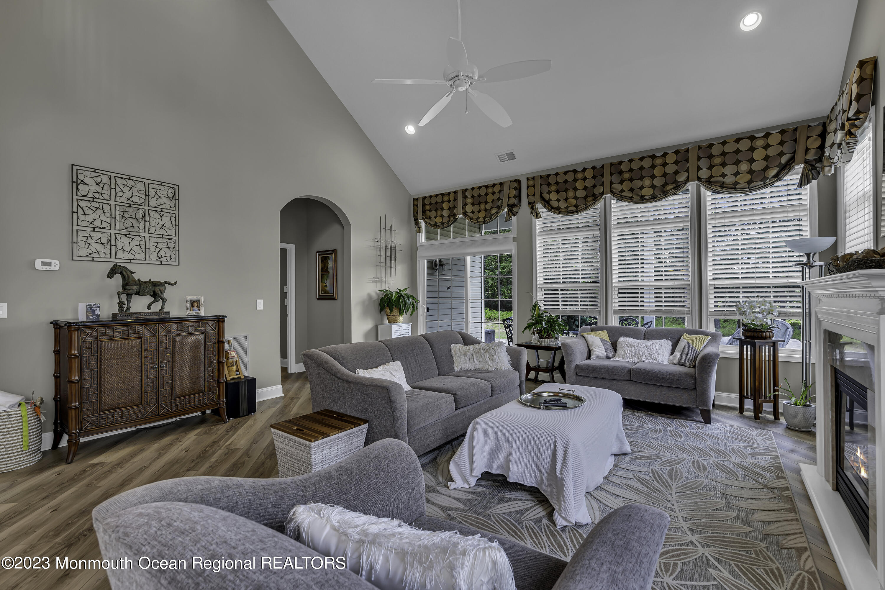63 Harvey Cedar Way Waretown, NJ 08758 - Photo 21 of 39 a living room with furniture and a large window
