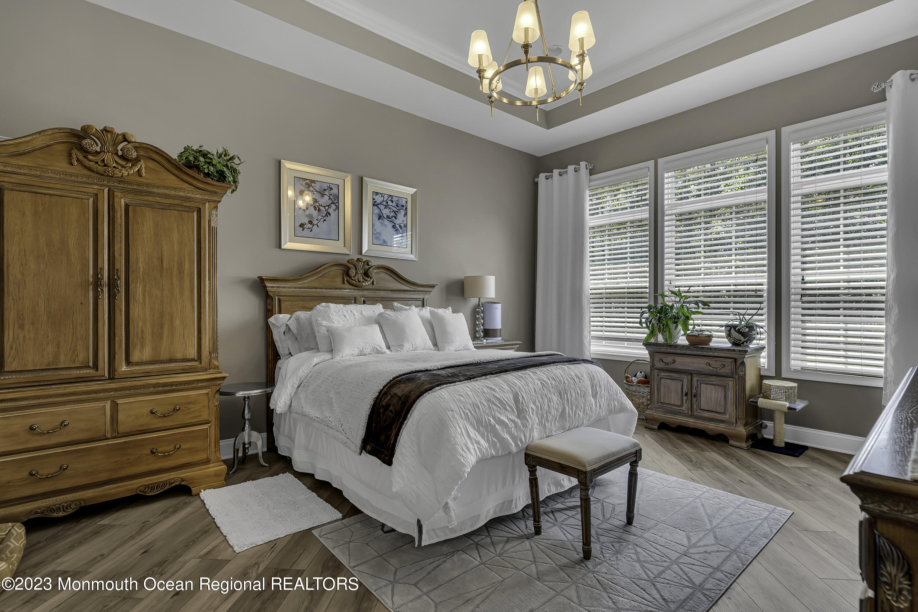 63 Harvey Cedar Way Waretown, NJ 08758 - Photo 22 of 39 a spacious bedroom with a bed a window and dresser