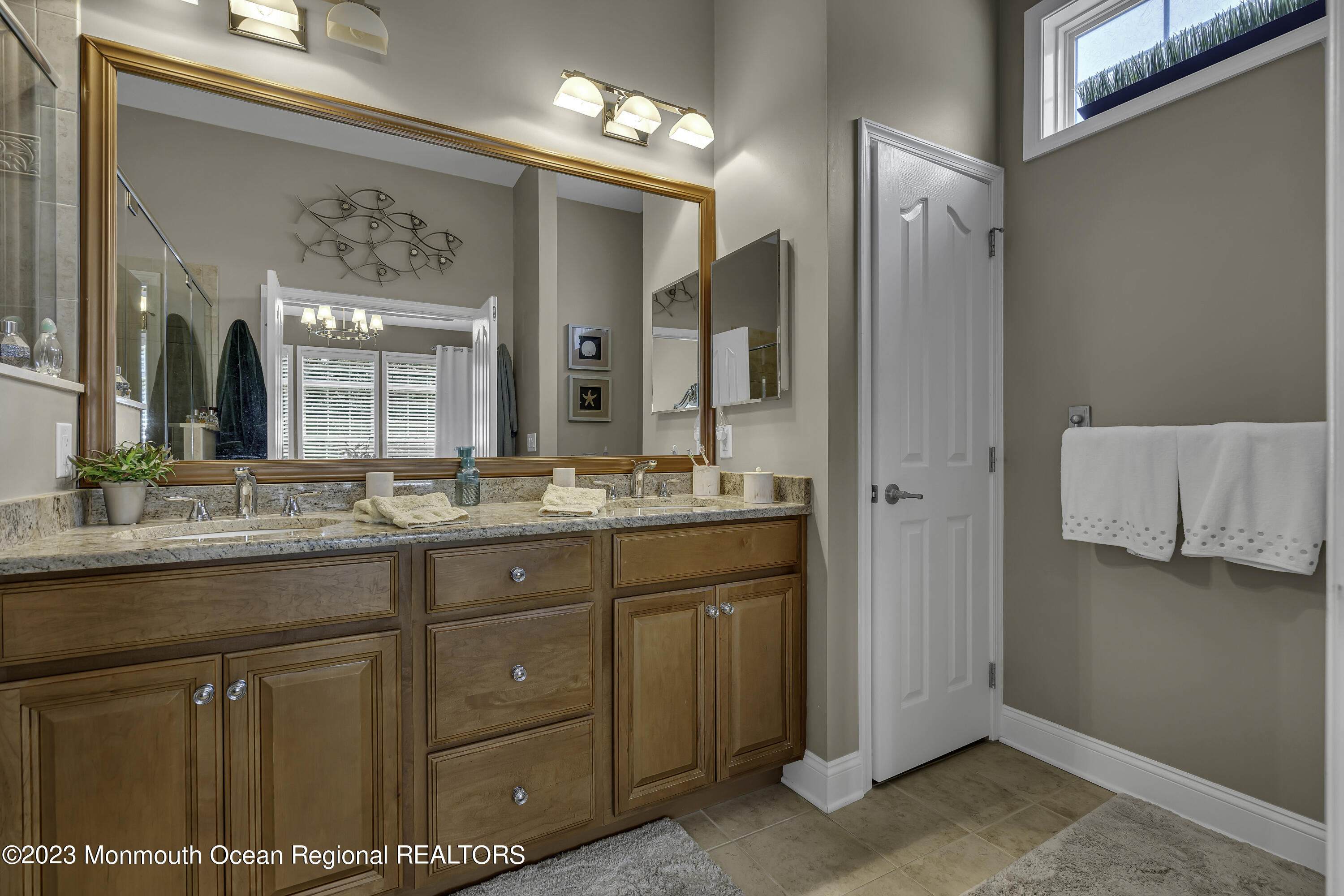 63 Harvey Cedar Way Waretown, NJ 08758 - Photo 24 of 39 a bathroom with a granite countertop sink a mirror and a shower