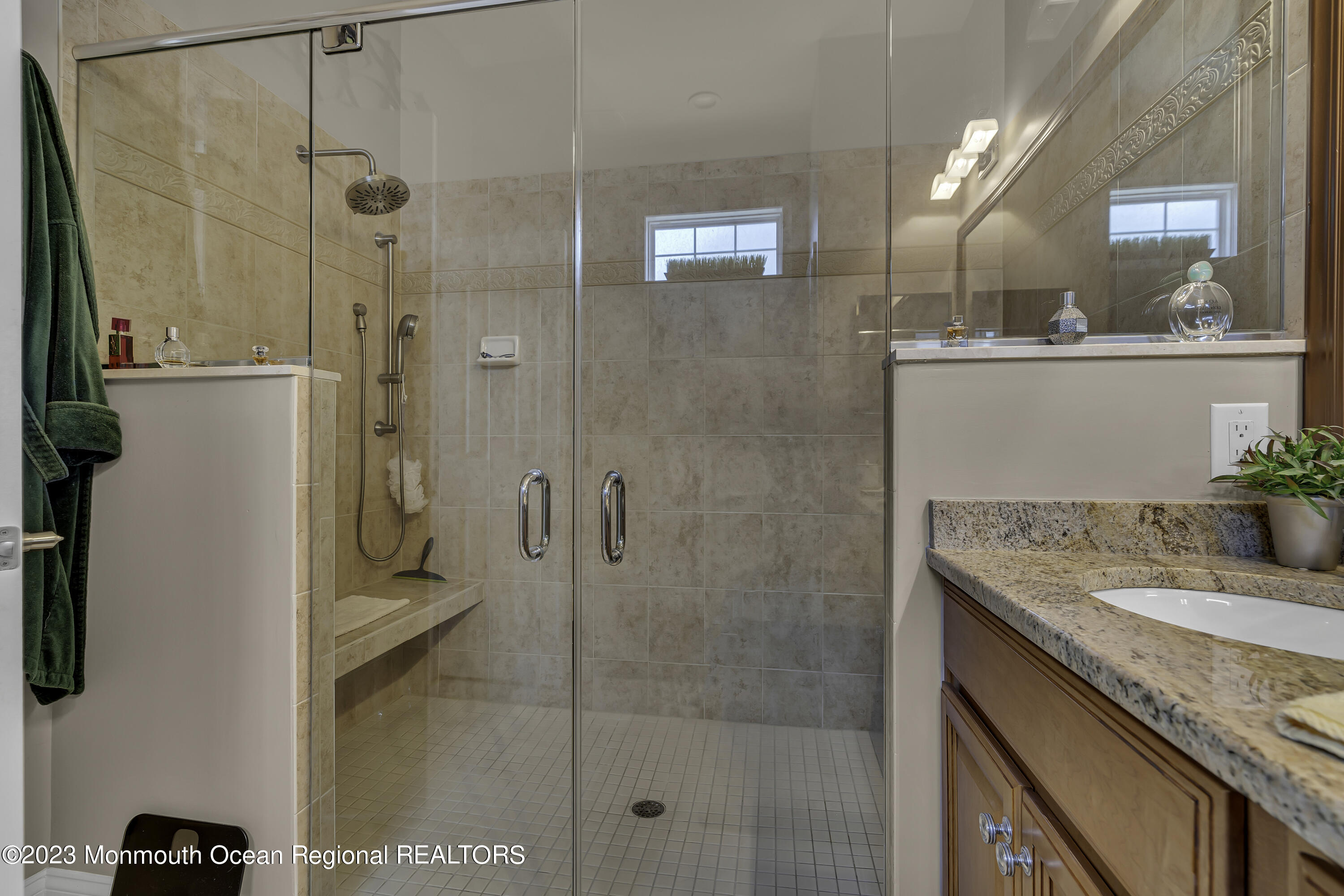 63 Harvey Cedar Way Waretown, NJ 08758 - Photo 25 of 39 a bathroom with a granite countertop sink a mirror and a shower