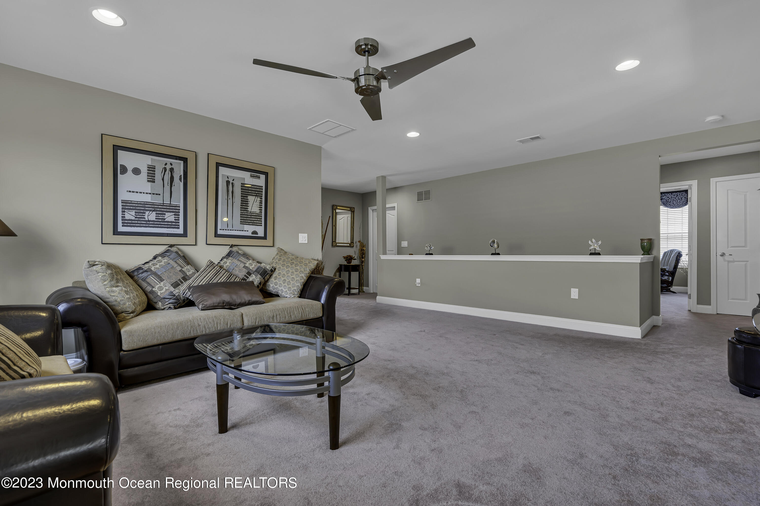 63 Harvey Cedar Way Waretown, NJ 08758 - Photo 29 of 39 a living room with furniture and a ceiling fan