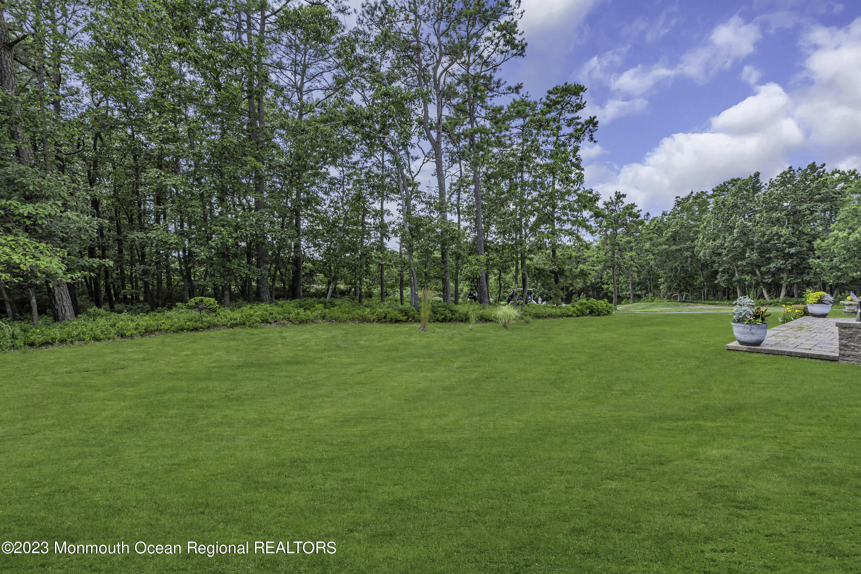 63 Harvey Cedar Way Waretown, NJ 08758 - Photo 3 of 39 a view of a park with large trees