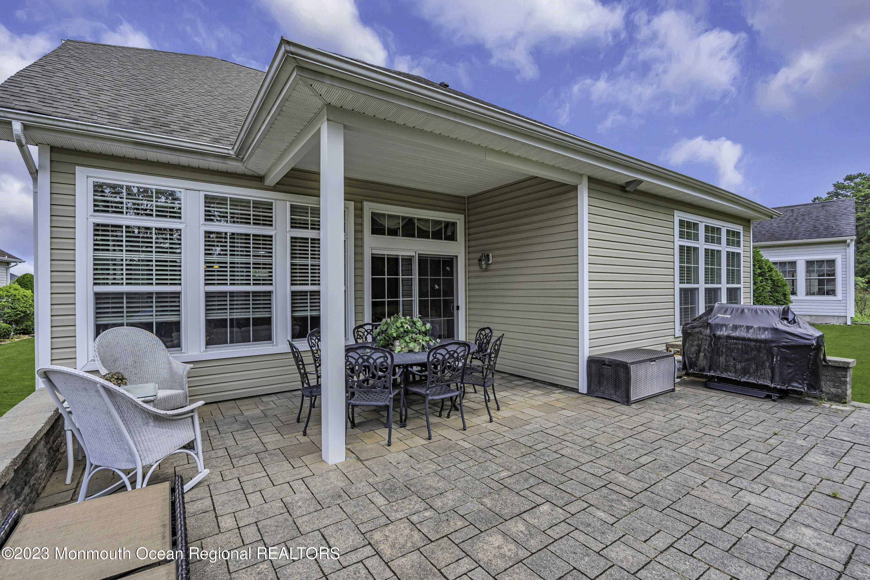 63 Harvey Cedar Way Waretown, NJ 08758 - Photo 36 of 39 a backyard of a house with outdoor seating