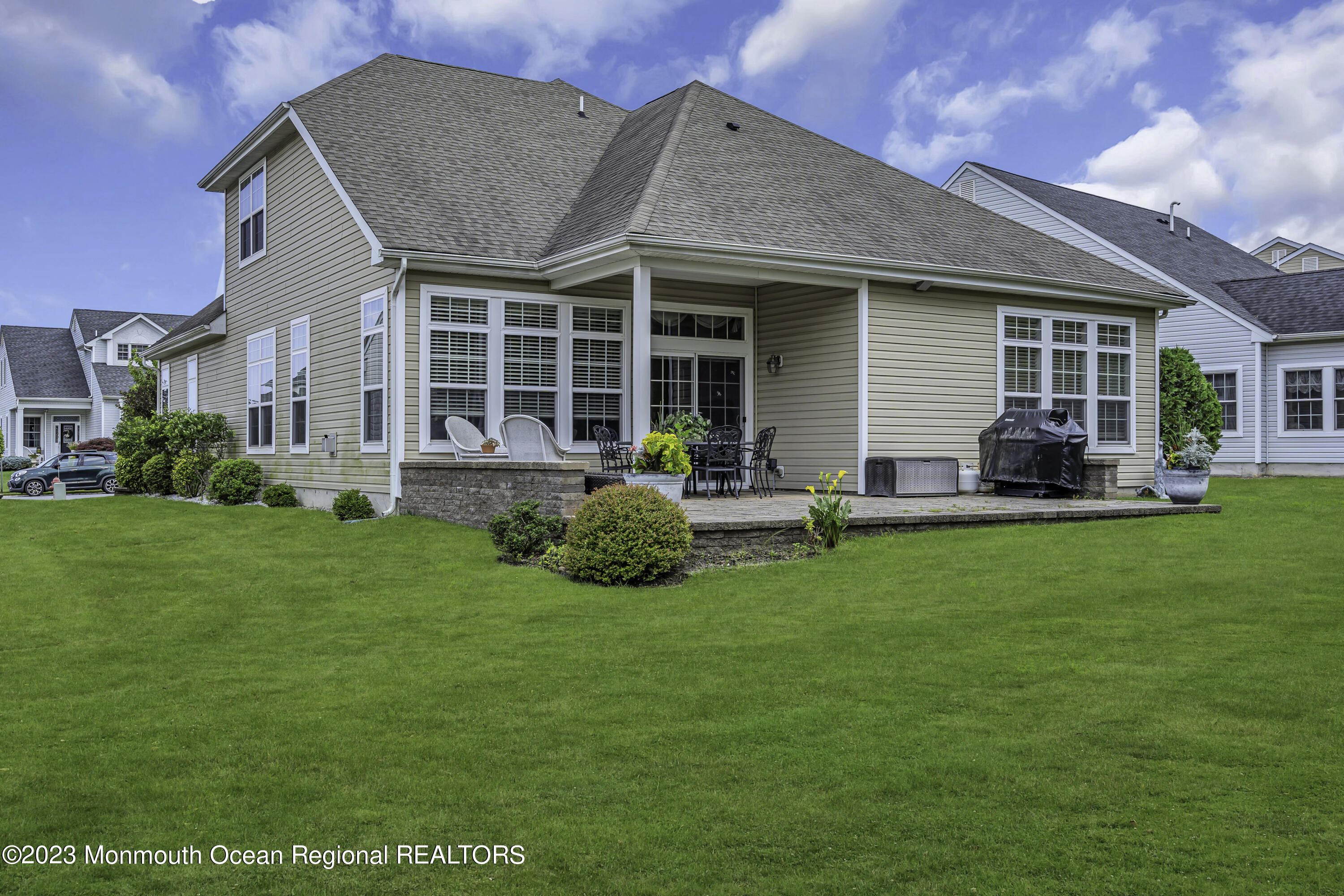 63 Harvey Cedar Way Waretown, NJ 08758 - Photo 38 of 39 a front view of house with yard and green space
