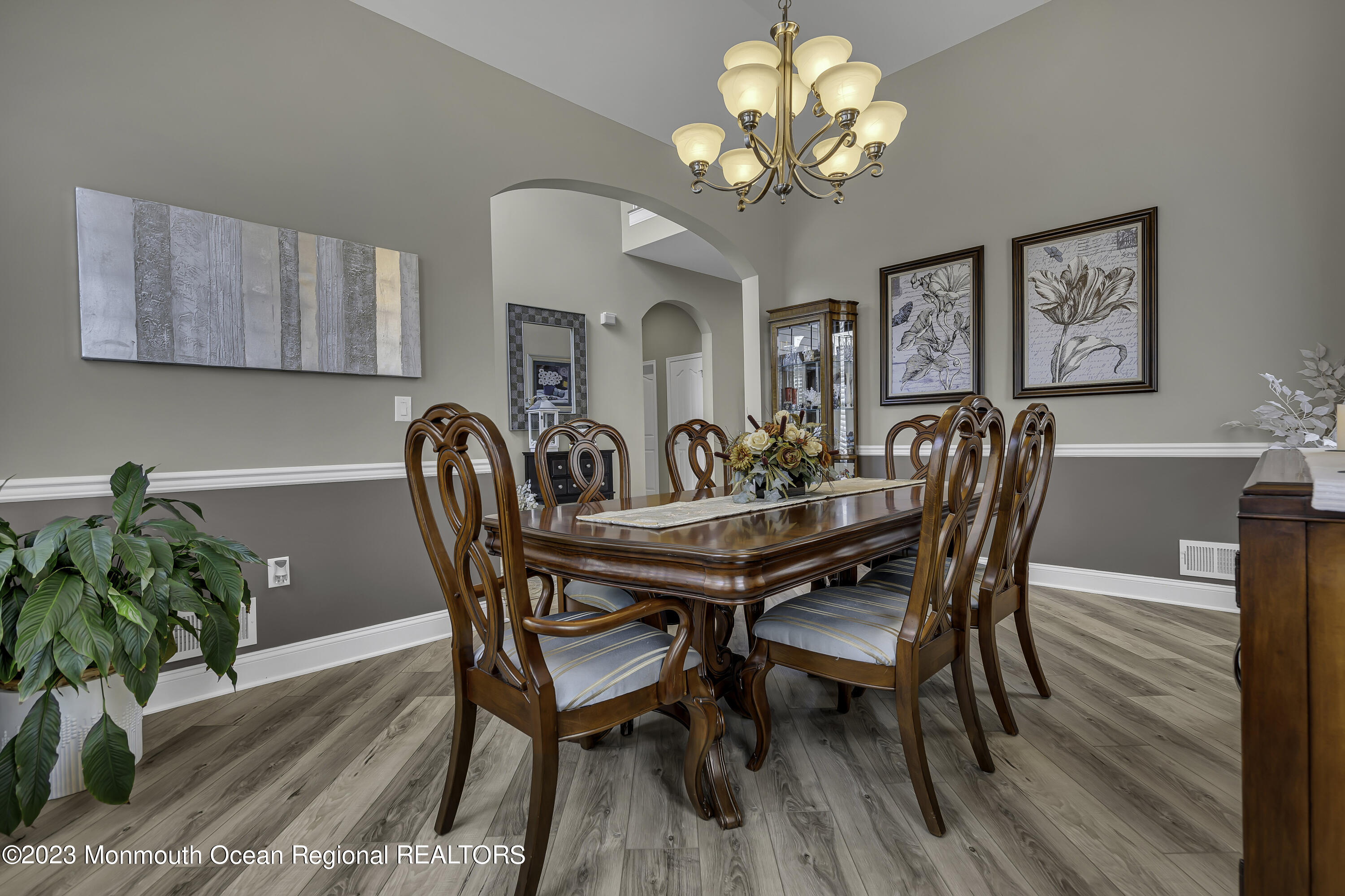 63 Harvey Cedar Way Waretown, NJ 08758 - Photo 10 of 39 a dining room with furniture potted plants and wooden floor