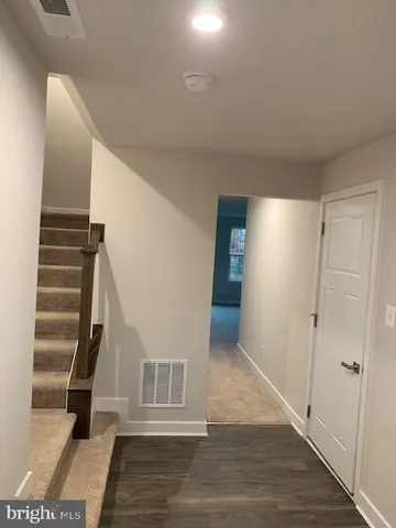 a view of entryway with wooden floor