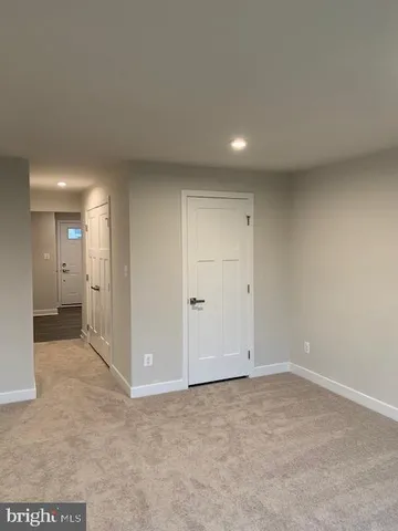 an empty room with a bathroom