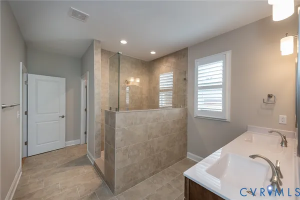 a bathroom with a bathtub and a sink