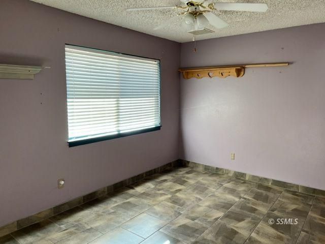 305 South Silver Ridge Street Ridgecrest, CA 93555 - Photo 26 of 32 a view of an empty room with a window