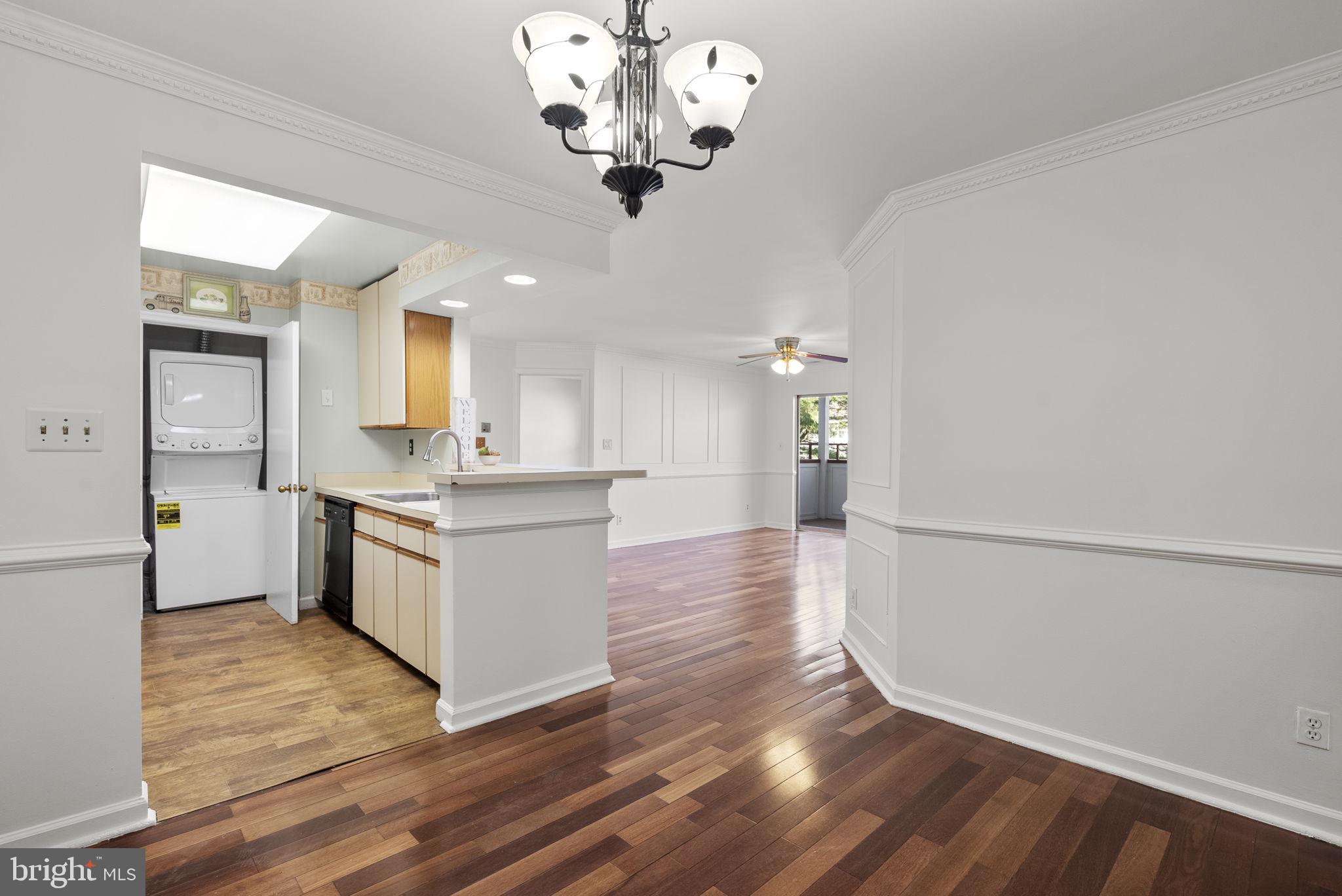 13708 Modrad Way, Unit 7B33 Silver Spring, MD 20904 - Photo 8 of 28 Kitchen, living room and dining room view