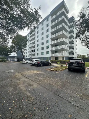 a view of street with parked cars