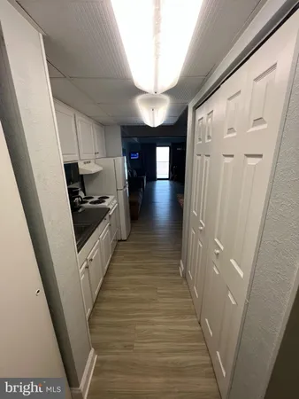 a kitchen with a stove and a refrigerator