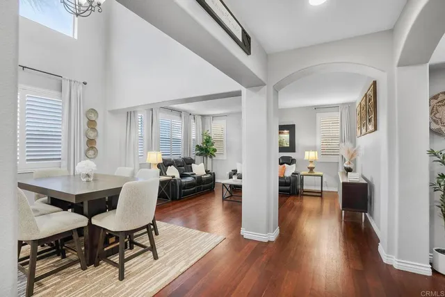 a view of a livingroom with furniture and a hardwood floor