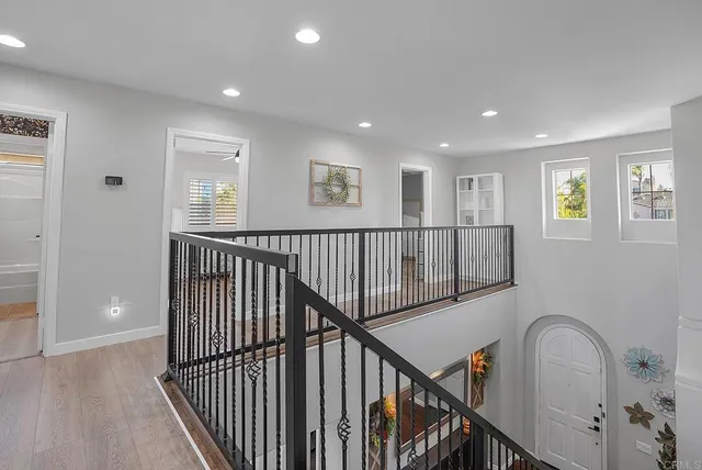 a view of entryway with wooden floor and stairs