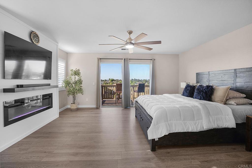 1777 Clover Tree Court Chula Vista, CA 91913 - Photo 20 of 49 a spacious bedroom with a bed and a flat screen tv
