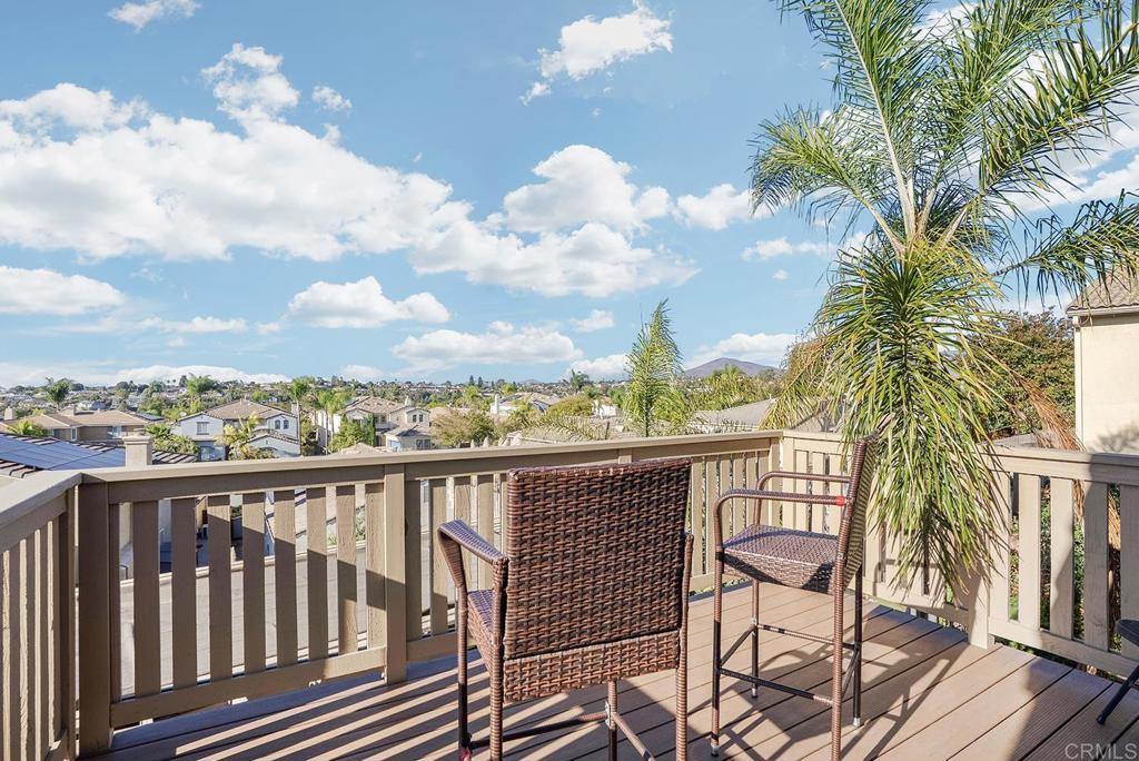 1777 Clover Tree Court Chula Vista, CA 91913 - Photo 23 of 49 a view of a balcony with wooden floor and iron fence
