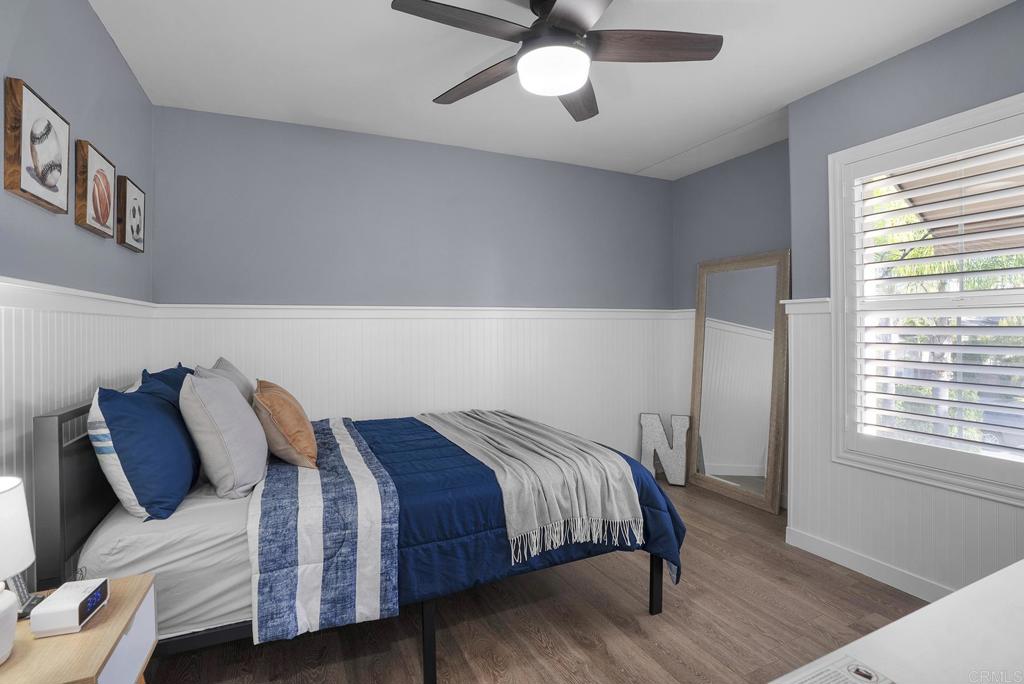 1777 Clover Tree Court Chula Vista, CA 91913 - Photo 27 of 49 a bedroom with a bed and wooden floor
