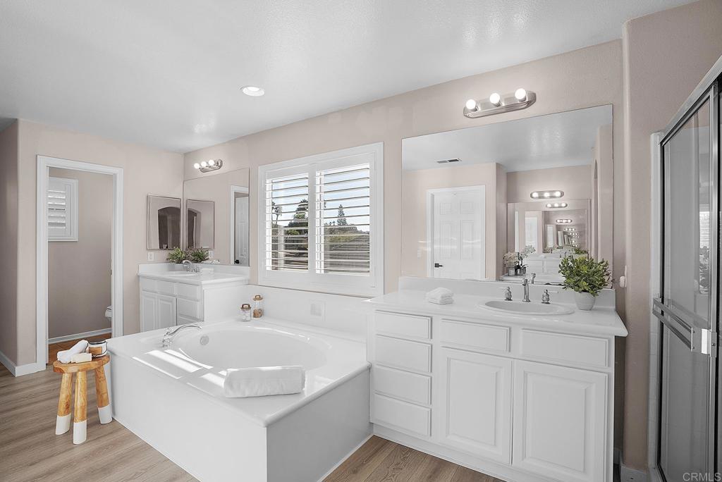 1777 Clover Tree Court Chula Vista, CA 91913 - Photo 30 of 49 a bathroom with a tub sink and mirror