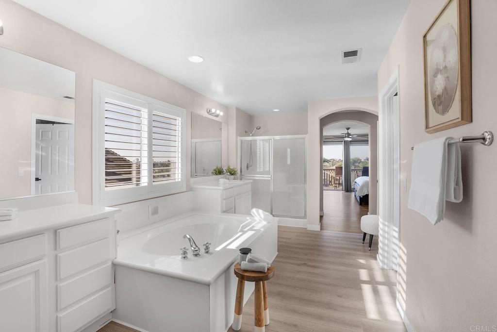 1777 Clover Tree Court Chula Vista, CA 91913 - Photo 31 of 49 a hallway with white cabinets and wooden floor