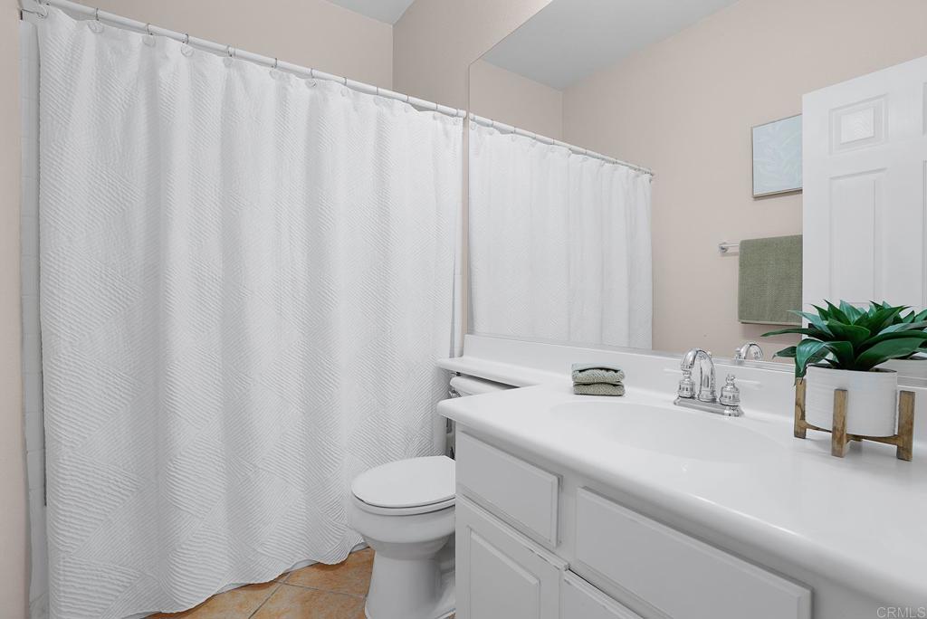 1777 Clover Tree Court Chula Vista, CA 91913 - Photo 34 of 49 a bathroom with a sink a toilet and a mirror