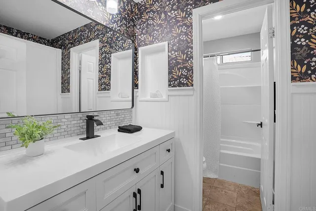 a bathroom with a sink and a mirror