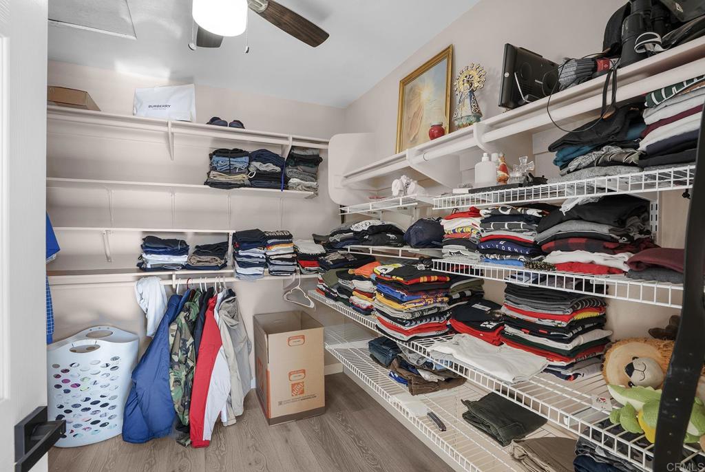 1777 Clover Tree Court Chula Vista, CA 91913 - Photo 36 of 49 a utility room with stainless steel appliances and wooden floors