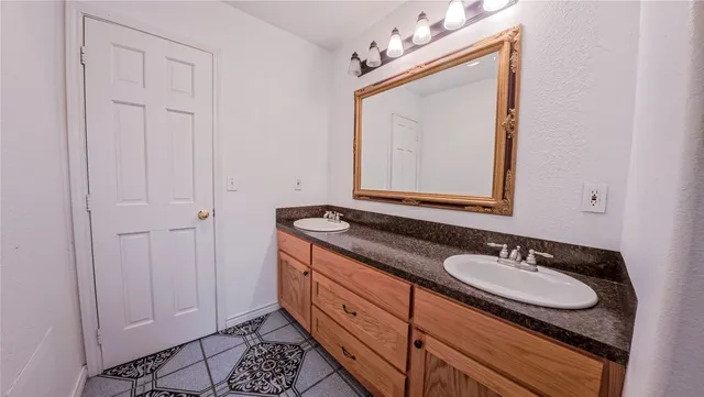 a view of a livingroom with a ceiling fan and window