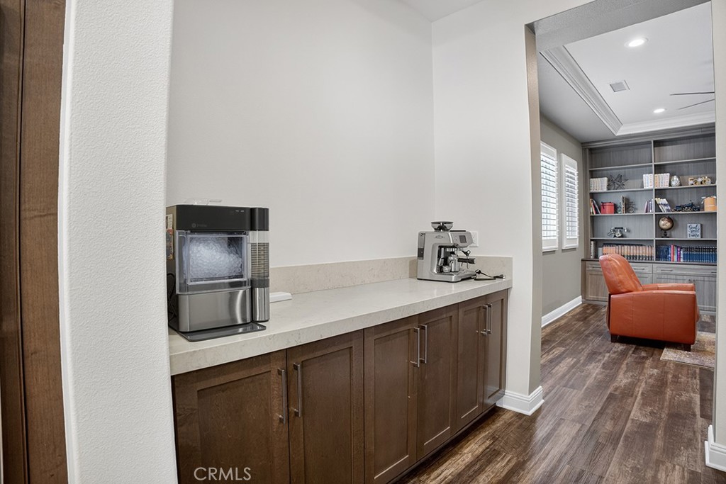 19843 Split Oak Road Chatsworth, CA 91311 - Photo 21 of 75 a kitchen with stainless steel appliances granite countertop a refrigerator a stove and a sink with wooden floor