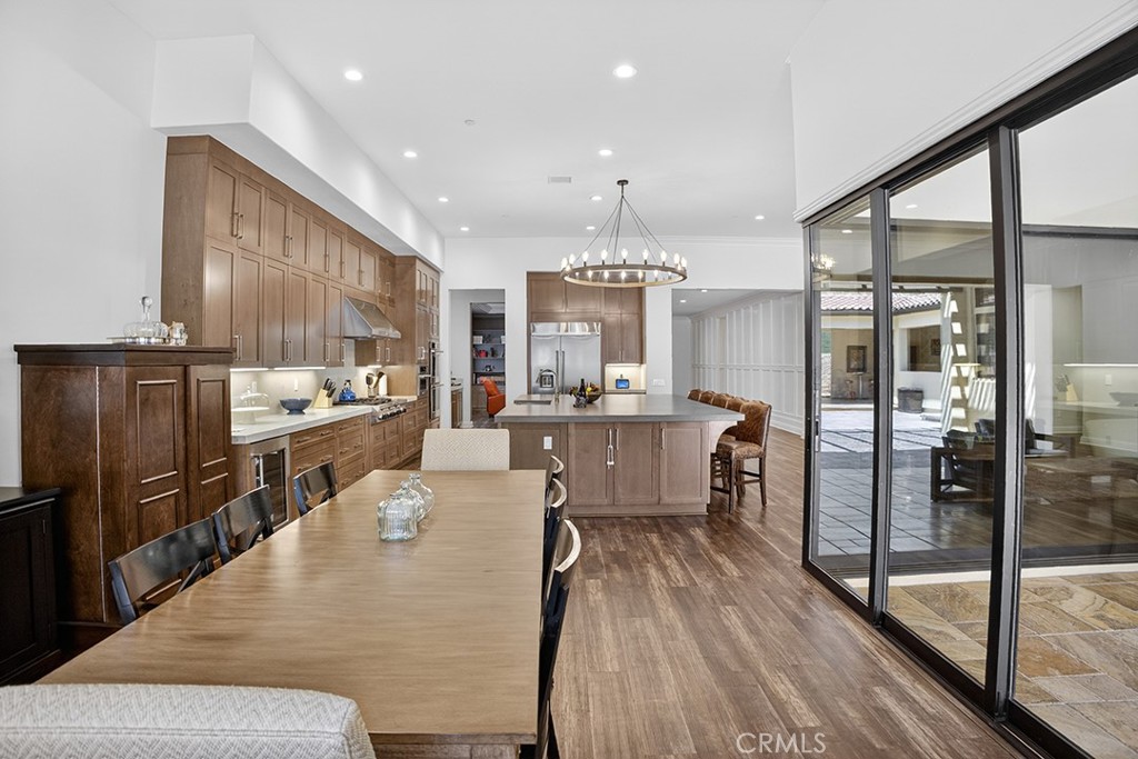 19843 Split Oak Road Chatsworth, CA 91311 - Photo 28 of 75 a large kitchen with stainless steel appliances kitchen island granite countertop a large kitchen island a stove and a refrigerator