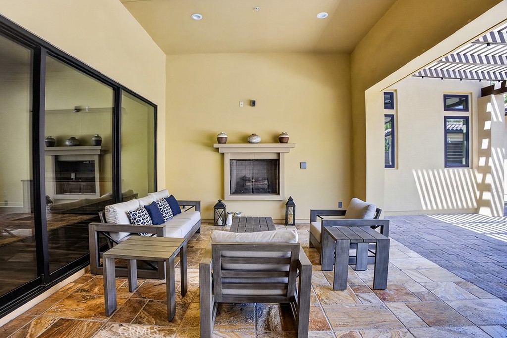 19843 Split Oak Road Chatsworth, CA 91311 - Photo 52 of 75 a living room with furniture a fireplace and a flat screen tv