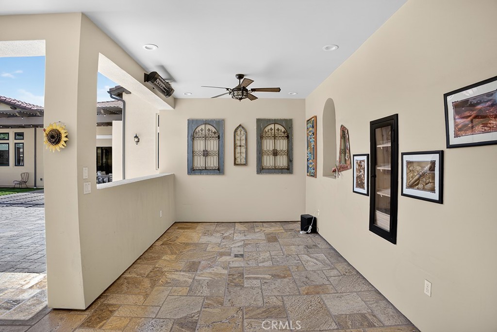 19843 Split Oak Road Chatsworth, CA 91311 - Photo 61 of 75 a view of a hallway with entryway windows chandelier and a kitchen view
