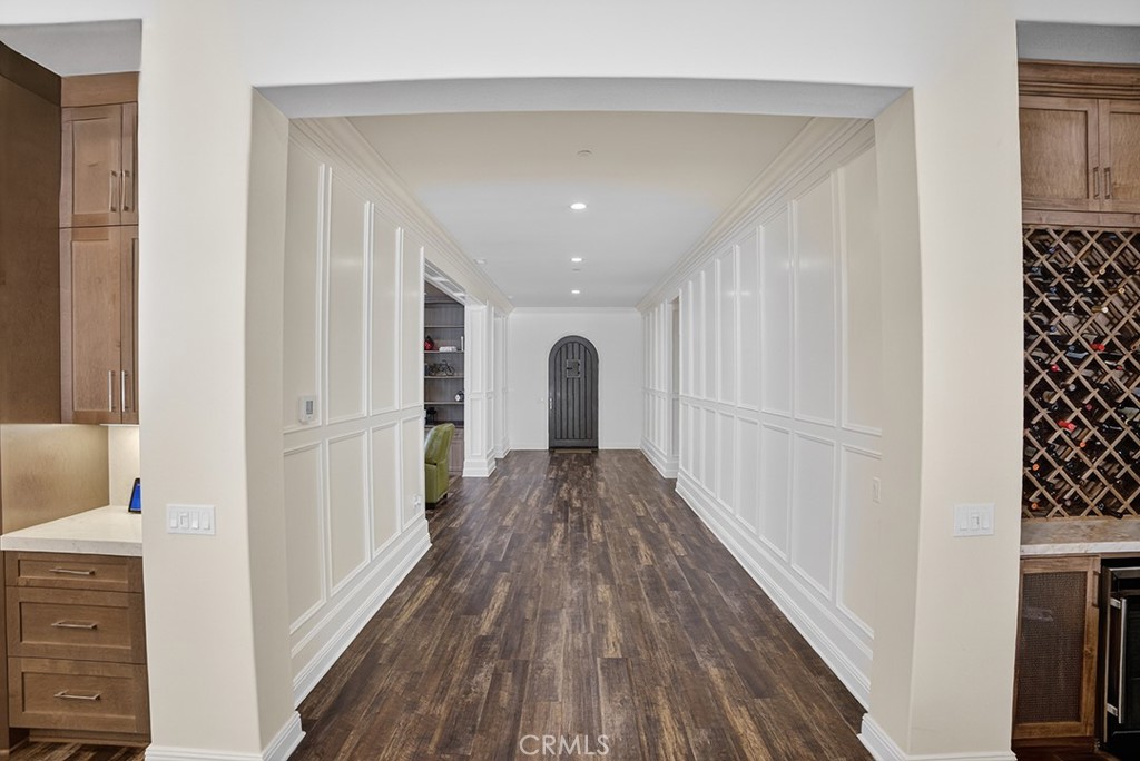 19843 Split Oak Road Chatsworth, CA 91311 - Photo 10 of 75 a view of a hallway with wooden floor and staircase