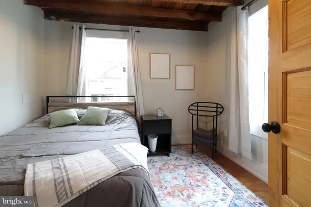 a bedroom with a bed and a dresser