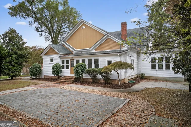 a front view of a house with garden