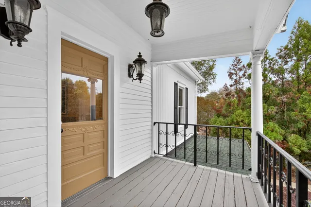 a view of a balcony with wooden floor