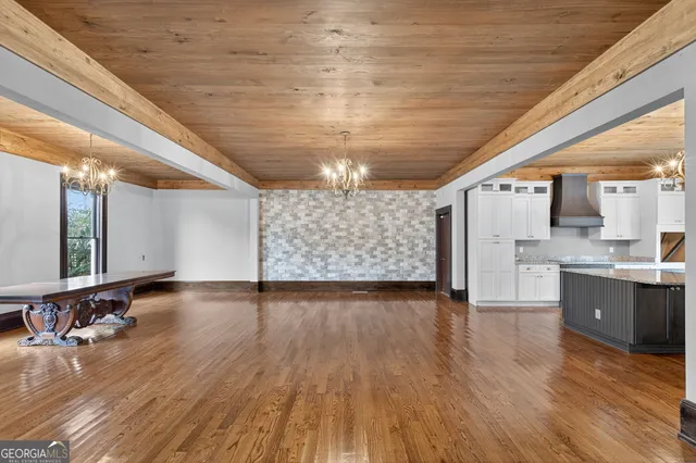 a view of a livingroom with wooden floor
