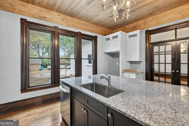 a kitchen with a sink and large window