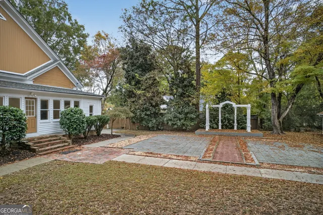 a front view of a house with yard