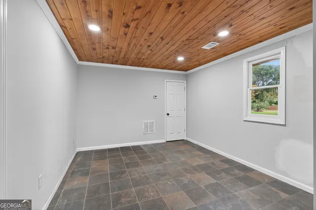 an empty room with windows