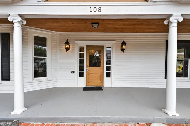 a front view of a building with a garage
