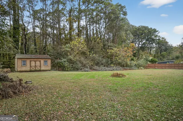a view of a yard with a tree