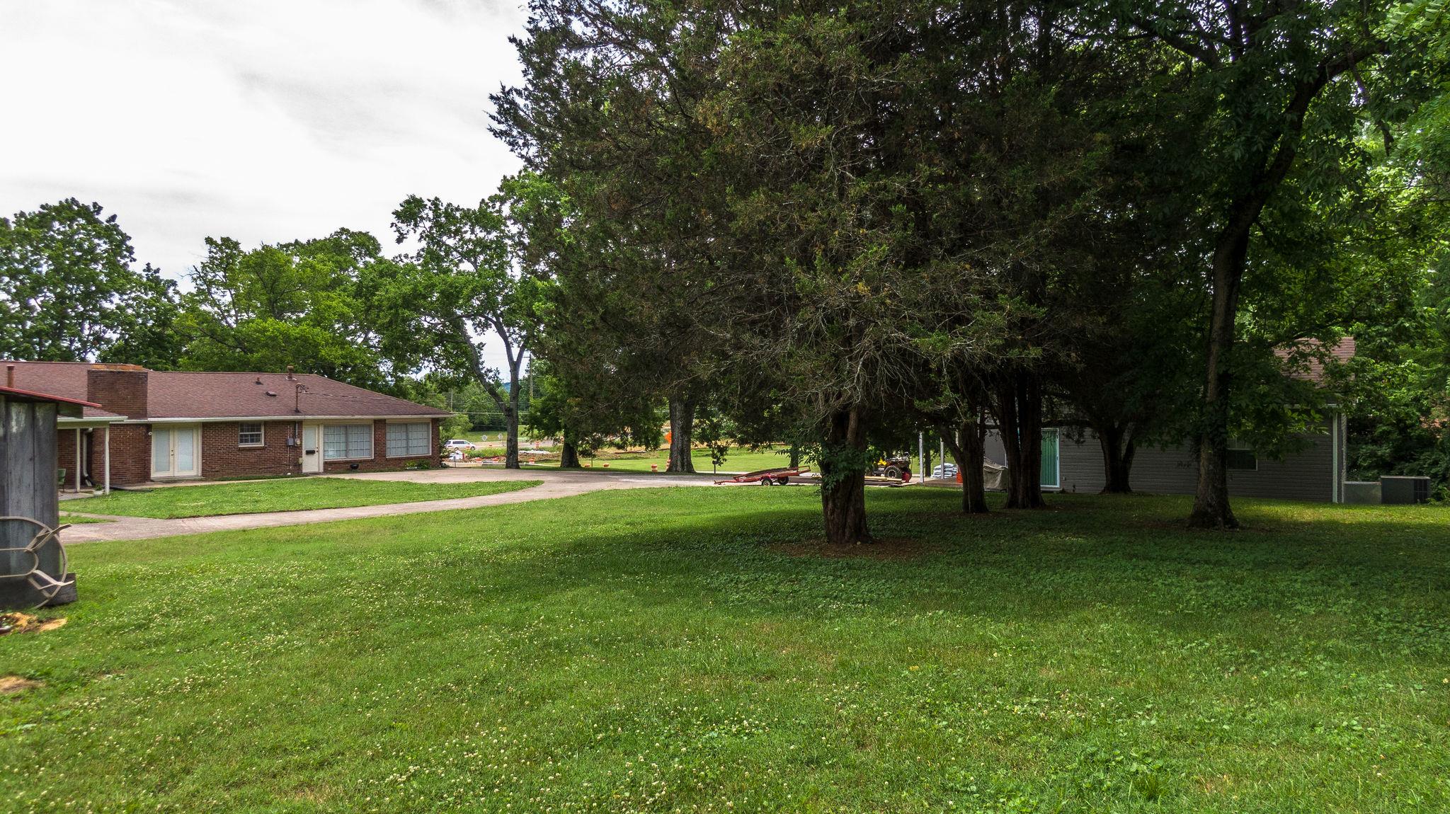 1219 Franklin Road Brentwood, TN 37027 - Photo 11 of 25 a view of a trees in front of a house