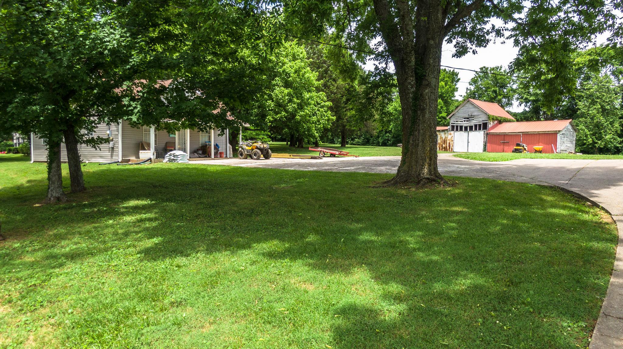 1219 Franklin Road Brentwood, TN 37027 - Photo 12 of 25 a view of a trees and basketball court
