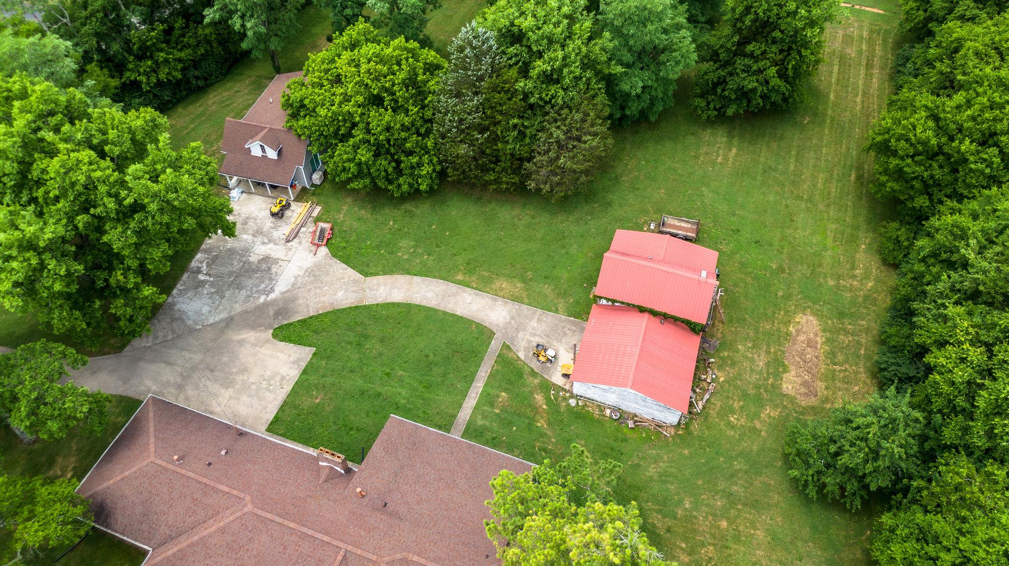 1219 Franklin Road Brentwood, TN 37027 - Photo 15 of 25 an aerial view of a house with a garden and lake view