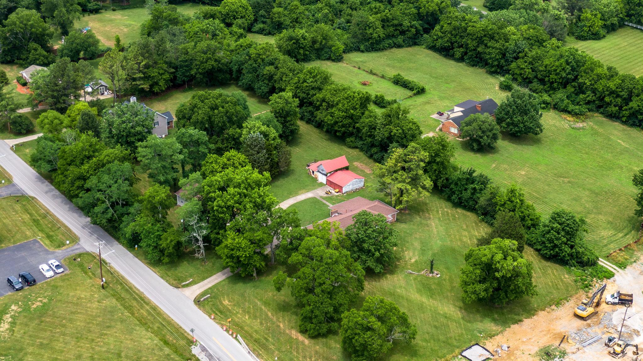 1219 Franklin Road Brentwood, TN 37027 - Photo 18 of 25 a view of a garden with a lake